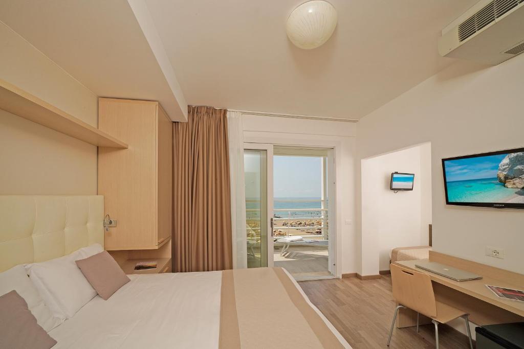 TV a/nebo společenská místnost v ubytování Hotel Strand a frontemare