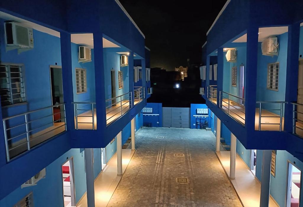 a view of an alley between two buildings at night at Residence MaryHouse in Cotonou