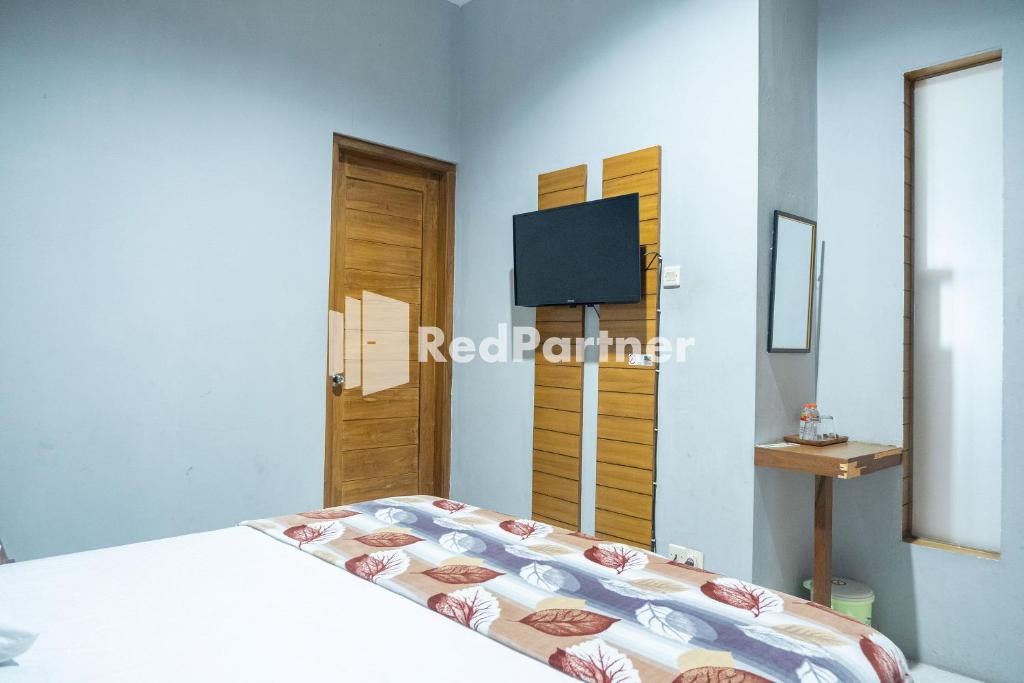 TV a/nebo společenská místnost v ubytování Omah Capung near Malioboro Area Mitra RedDoorz