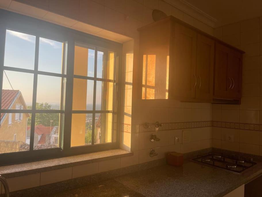 a kitchen with a window and a kitchen counter at Nature Scape II in Seia