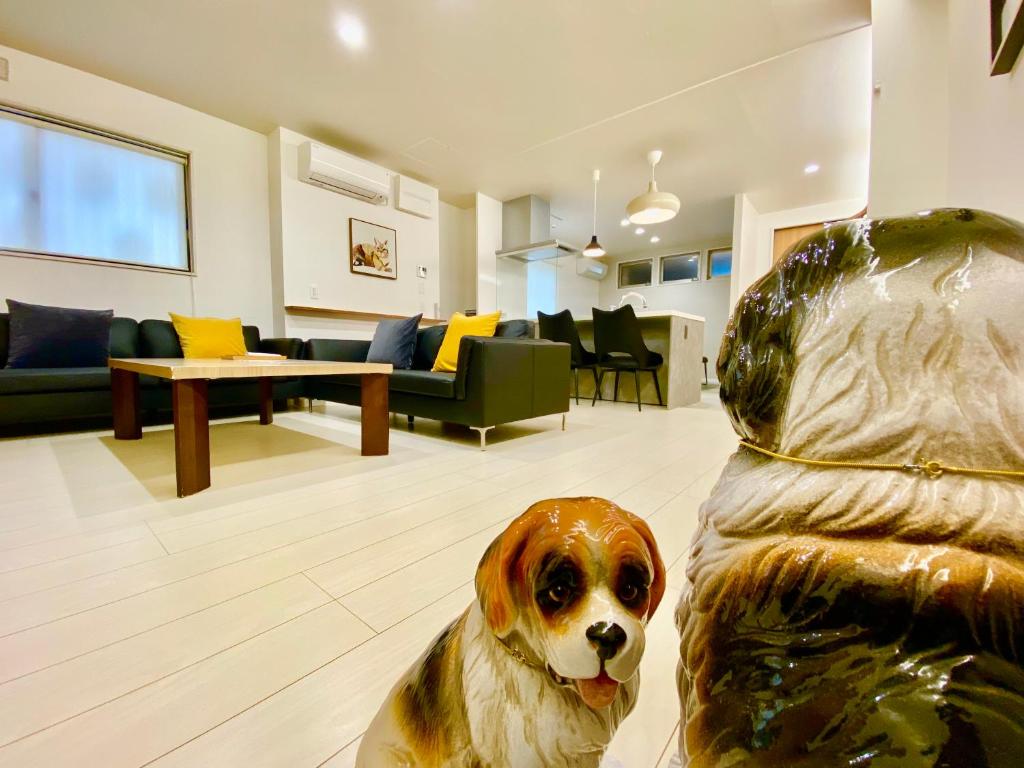 a statue of a dog sitting in a living room at Villa Monica in Nagoya
