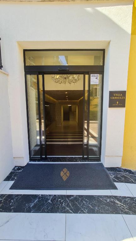 a building with a glass door with a heart on the floor at Amadria Park Grand Hotel 4 Opatijska Cvijeta in Opatija