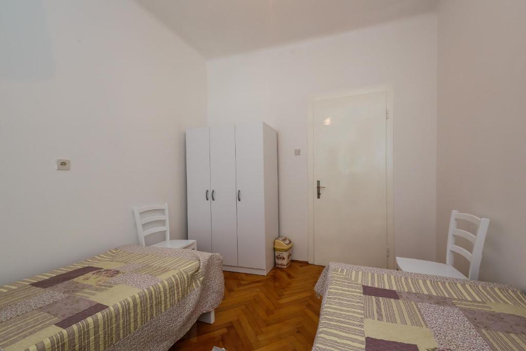 Postel nebo postele na pokoji v ubytování Apartments Jelen