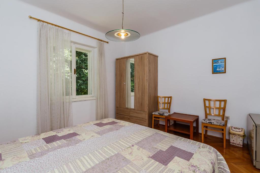 Postel nebo postele na pokoji v ubytování Apartments Jelen