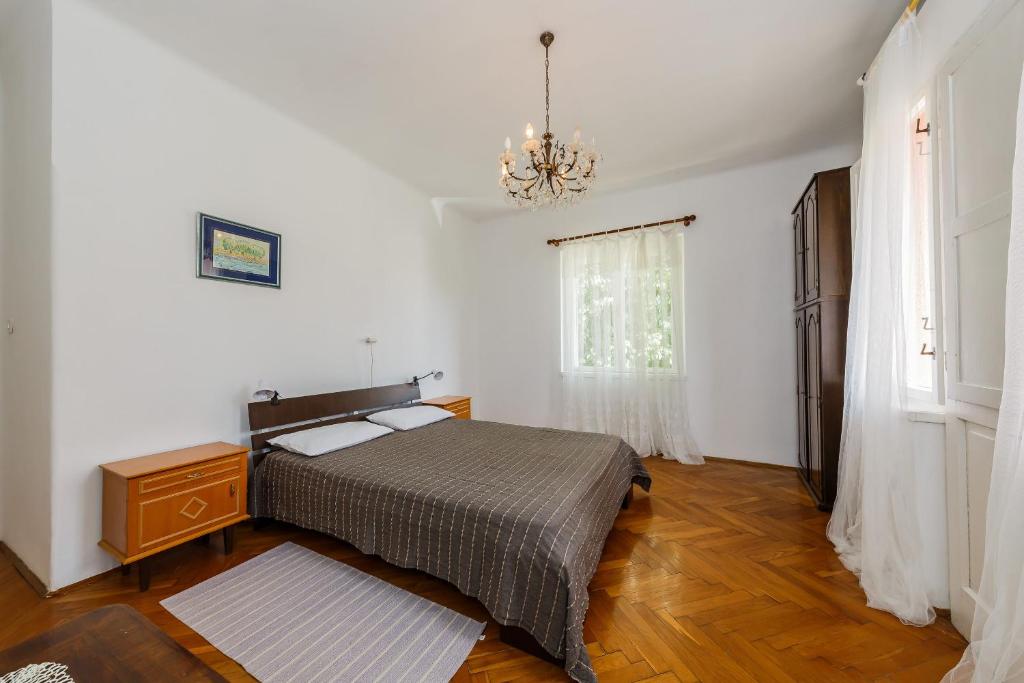 Postel nebo postele na pokoji v ubytování Apartments Jelen