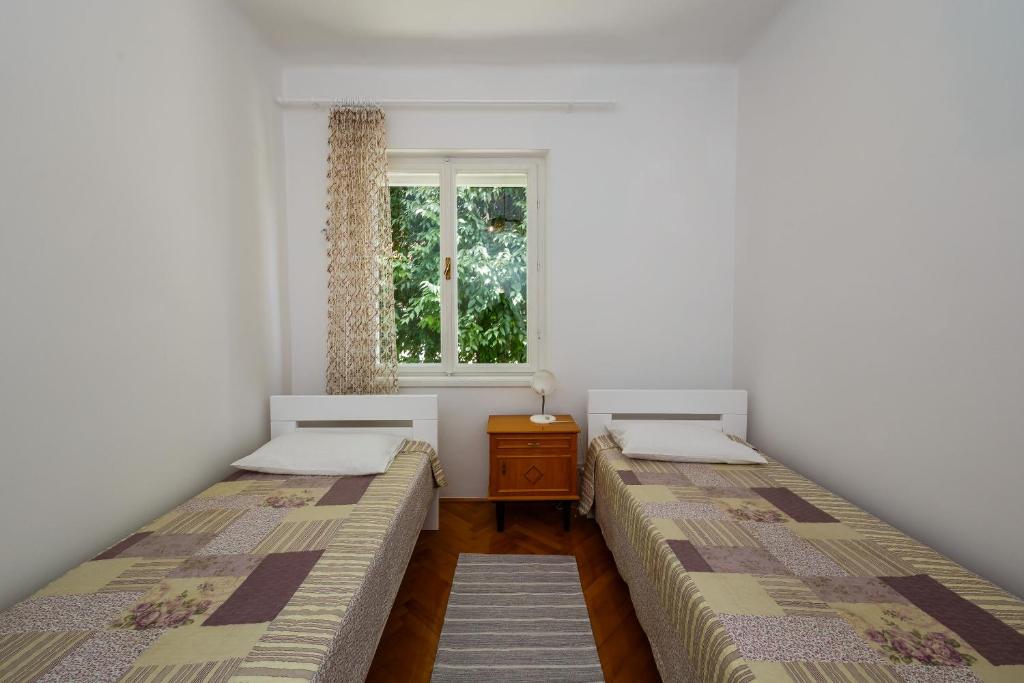 Postel nebo postele na pokoji v ubytování Apartments Jelen