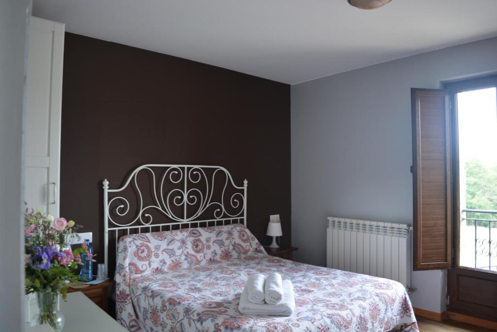 A bed or beds in a room at el calero