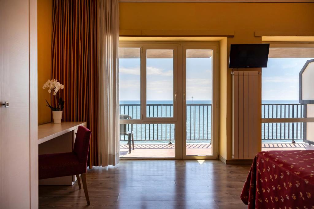 Postel nebo postele na pokoji v ubytování Hotel Villa Margherita