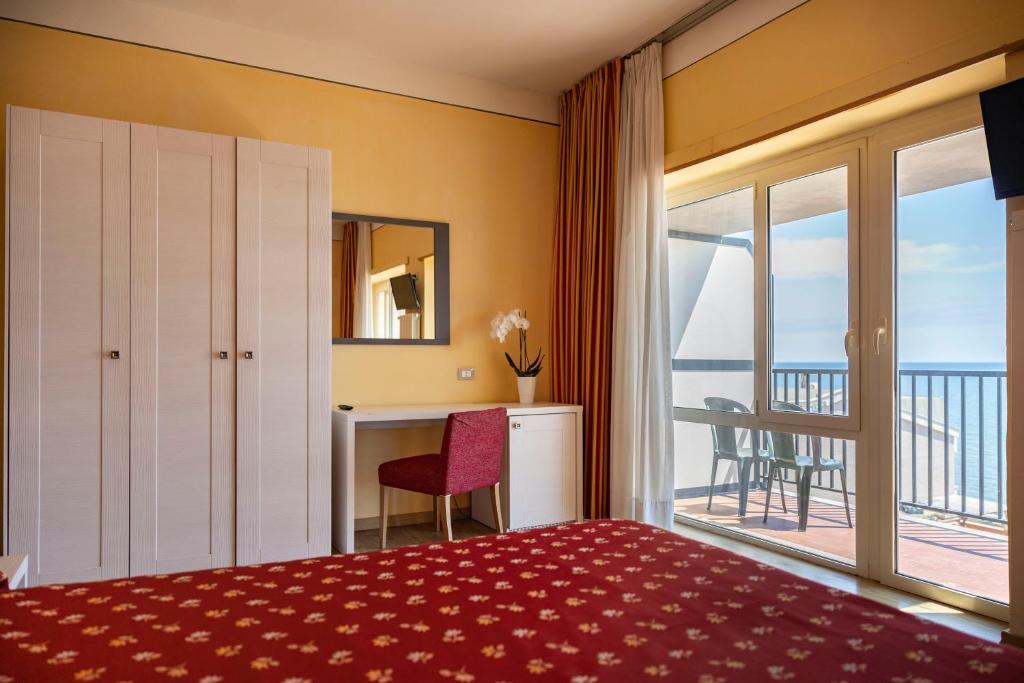 Postel nebo postele na pokoji v ubytování Hotel Villa Margherita