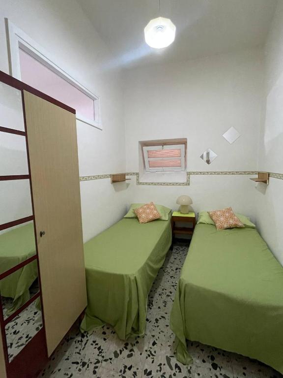 Postel nebo postele na pokoji v ubytování Scauri Holiday