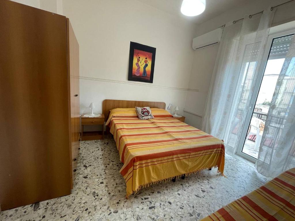 Postel nebo postele na pokoji v ubytování Scauri Holiday