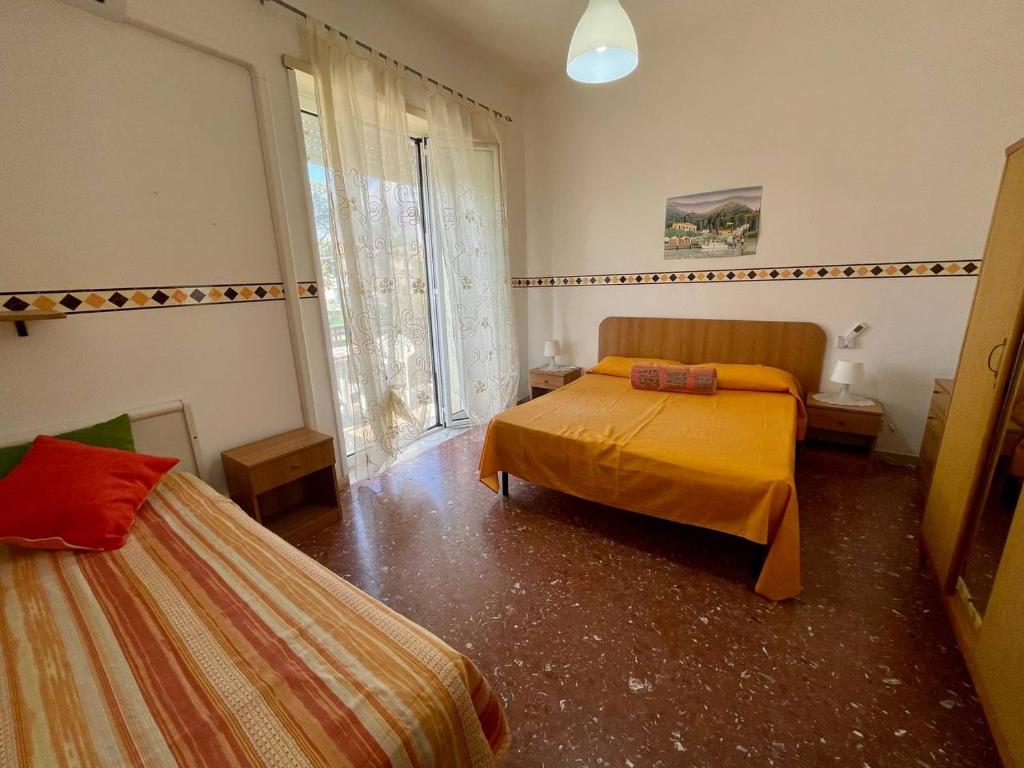Postel nebo postele na pokoji v ubytování Scauri Holiday
