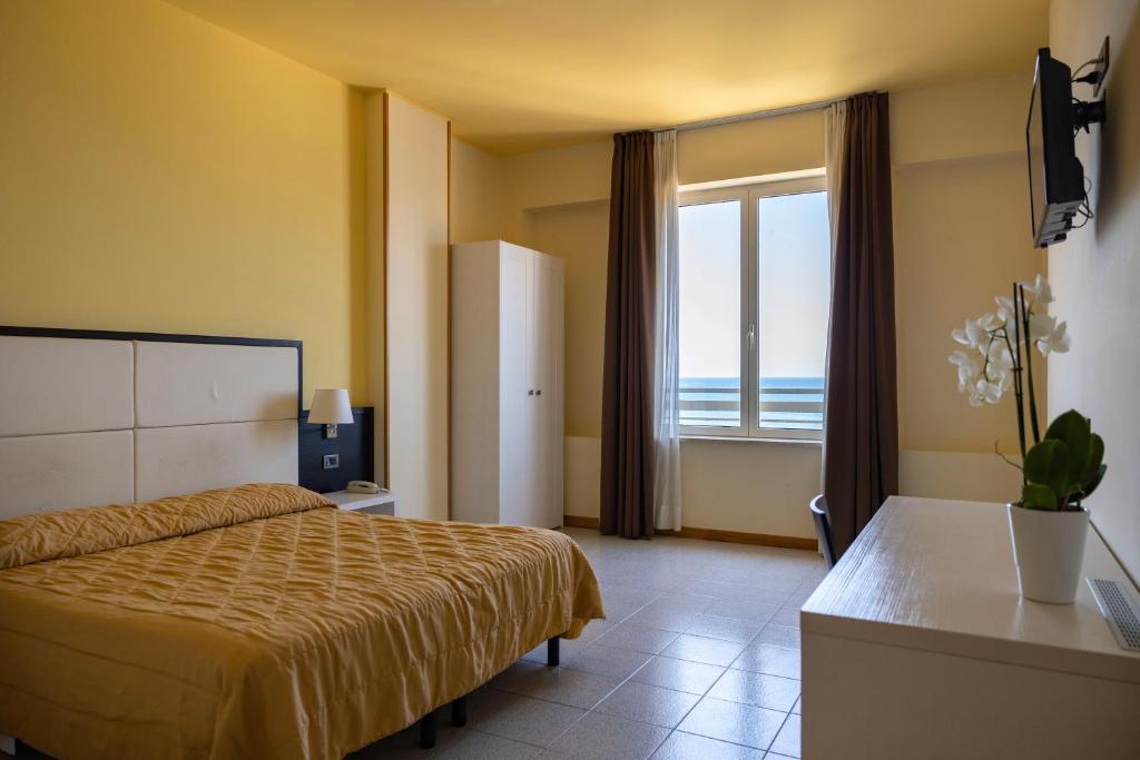 Postel nebo postele na pokoji v ubytování Hotel Villa Margherita