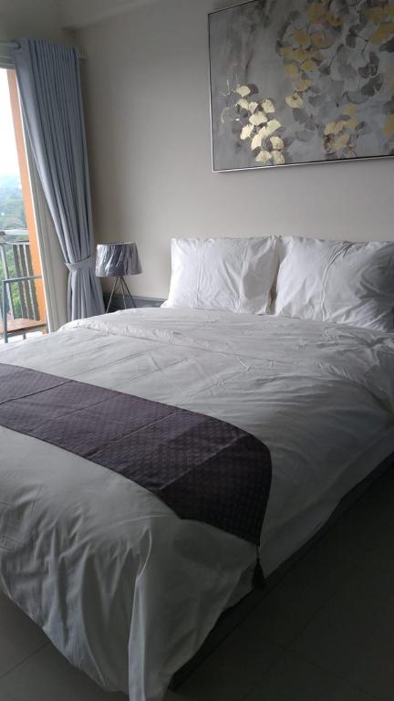 Postel nebo postele na pokoji v ubytování Galeri Ciumbuleuit Apartment 3 by Gezonder