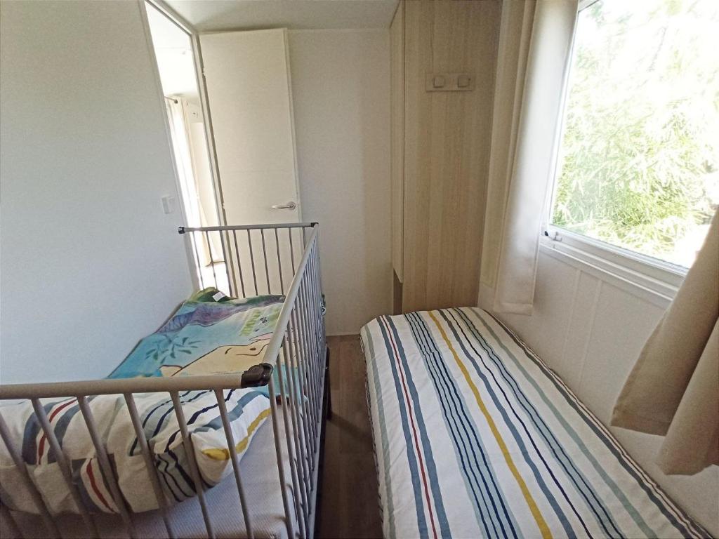 Postel nebo postele na pokoji v ubytování Casitas Mobil Home