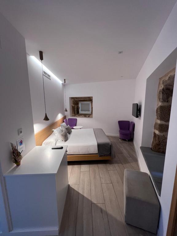 A bed or beds in a room at Hotel Nande
