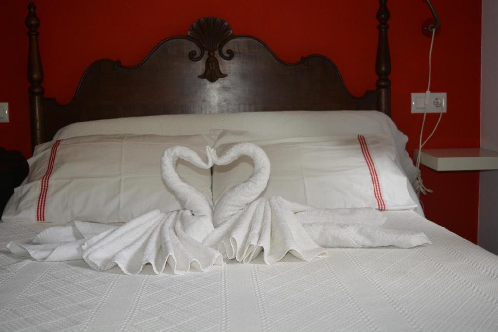 A bed or beds in a room at el calero