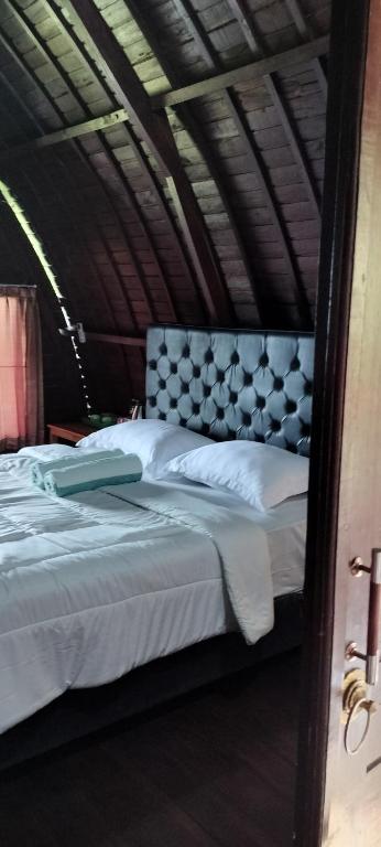 Postel nebo postele na pokoji v ubytování D'kailash Retreat