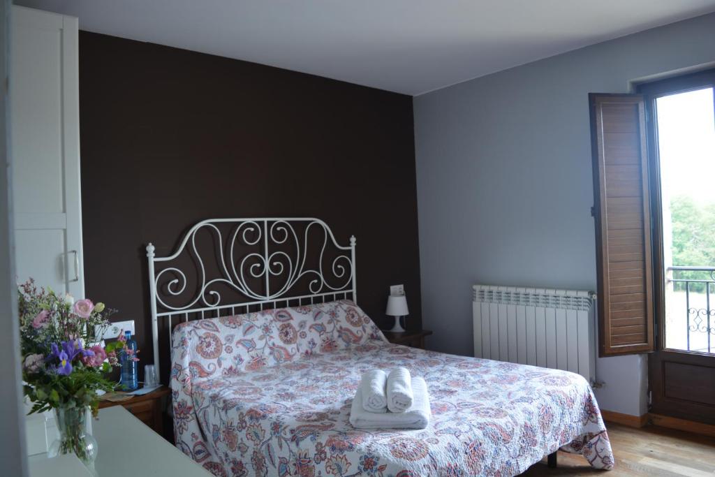 A bed or beds in a room at el calero