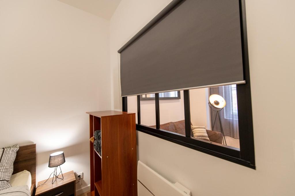 Posteľ alebo postele v izbe v ubytovaní KASA LOFT CENTRE 2 - WIFI et TV - Confortable et stationnement gratuit à proximité