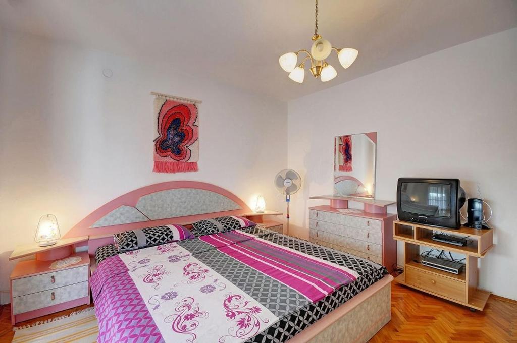 Postel nebo postele na pokoji v ubytování Apartments Marica