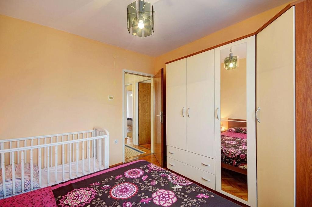 Postel nebo postele na pokoji v ubytování Apartments Marica