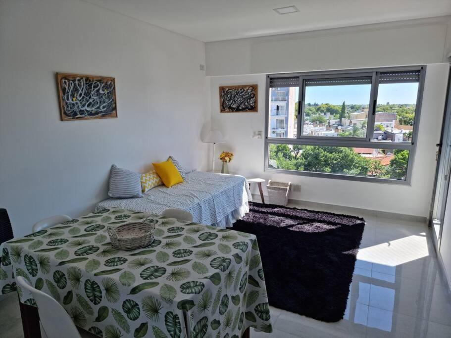 Giường trong phòng chung tại Hermoso departamento cerca del parque y centro