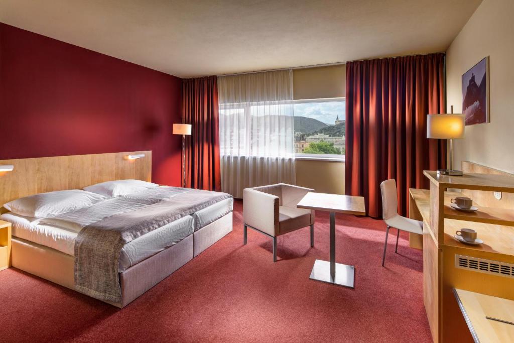 Postel nebo postele na pokoji v ubytování Clarion Congress Hotel Ústí nad Labem