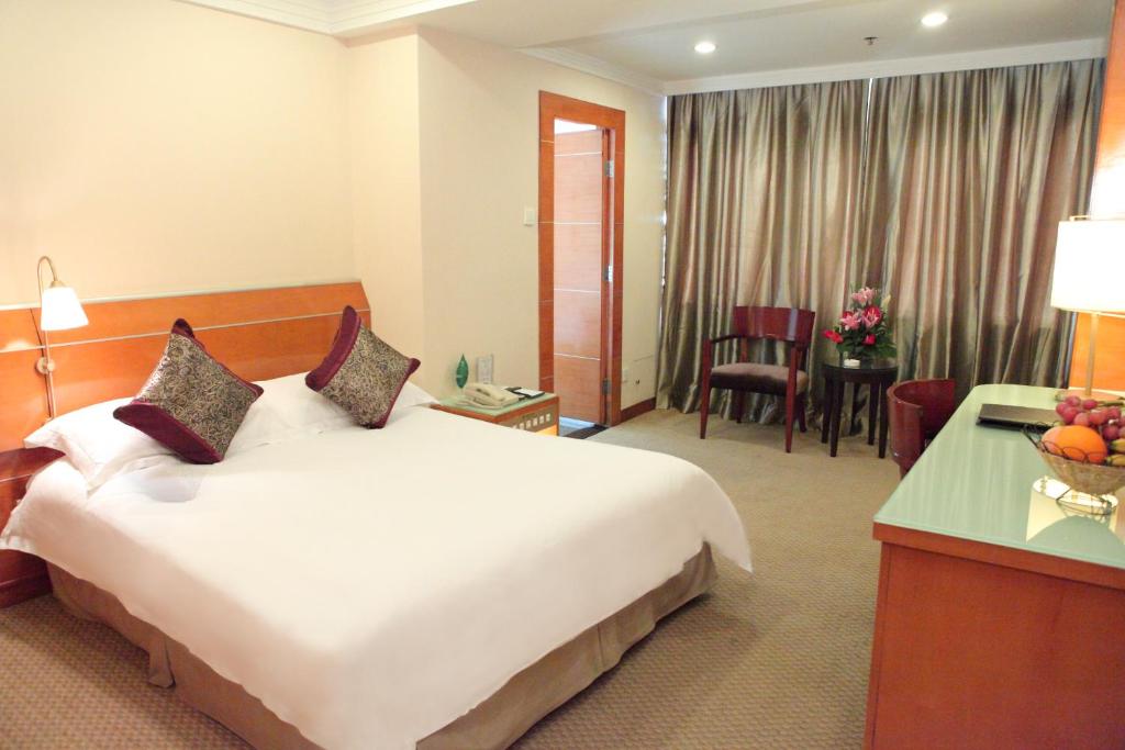 Postel nebo postele na pokoji v ubytování Yihe Hotel Ouzhuang