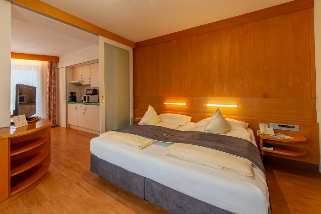 Postel nebo postele na pokoji v ubytování Frühstücks-Hotel Olympia