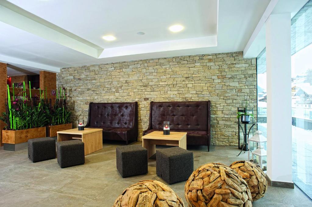 Χώρος καθιστικού στο Hotel ALPINA