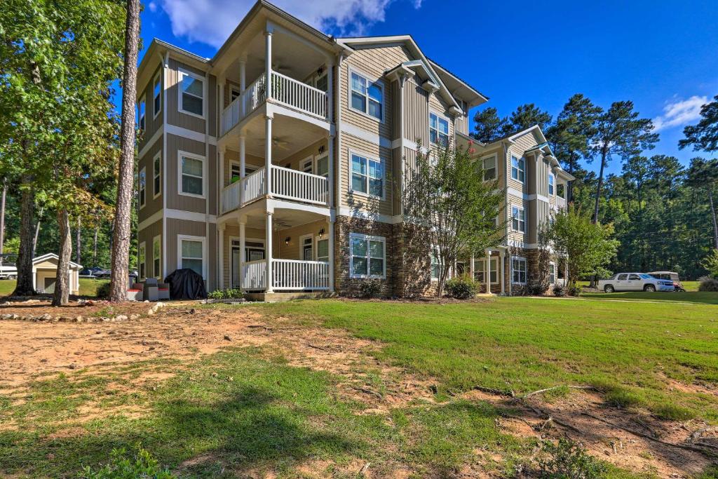 a large apartment building with a yard at Sunset Cove Condo Access to Lake Sinclair in Sparta