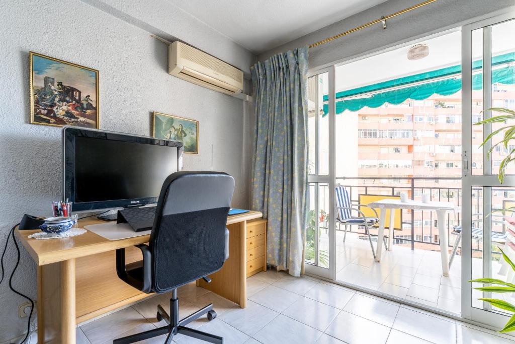 A television and/or entertainment centre at Apartamento Torres ll