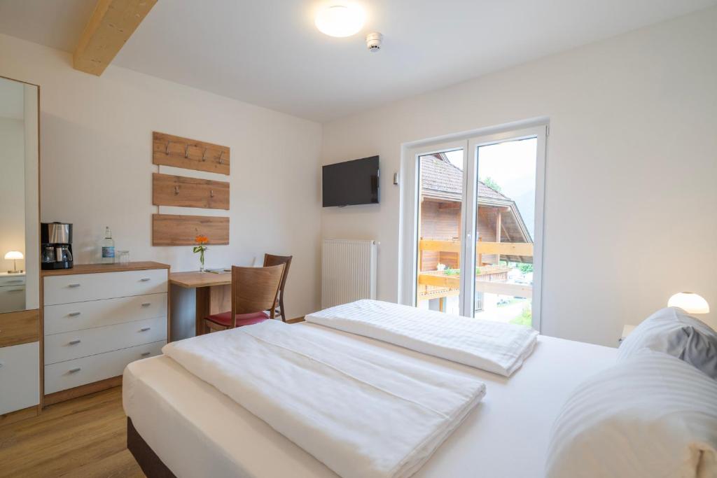 Postel nebo postele na pokoji v ubytování Wellness Landhaus Parth