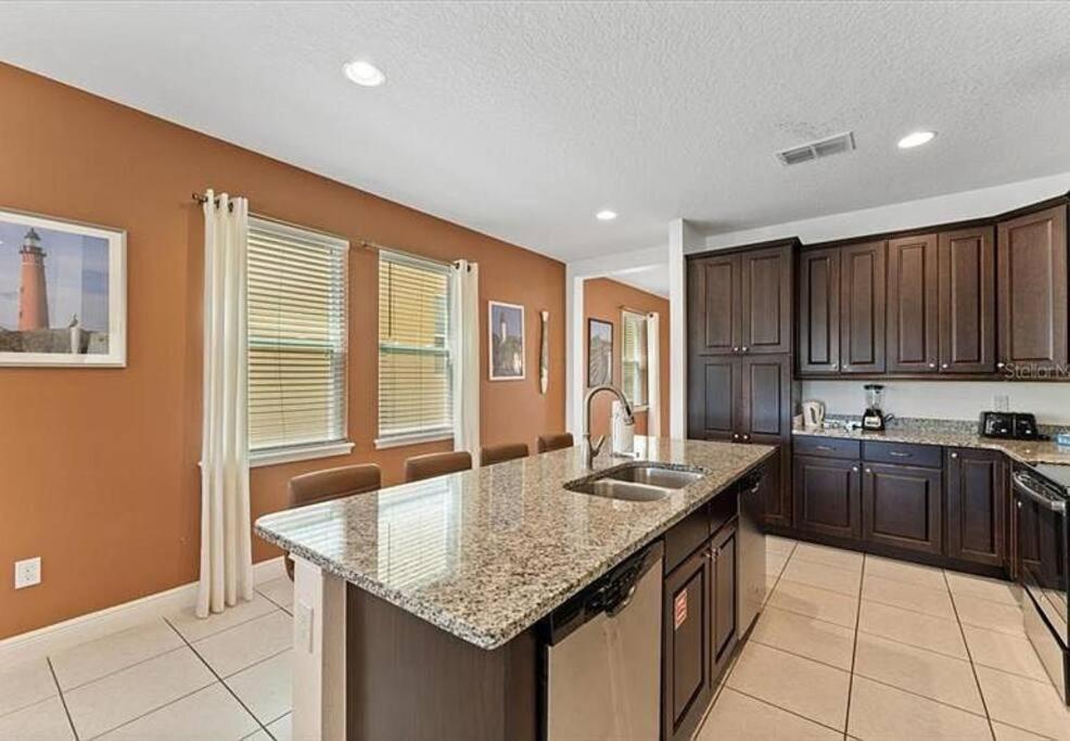 a kitchen with a sink and a counter top at 371 P Luxury Villa- New Listing in Orlando