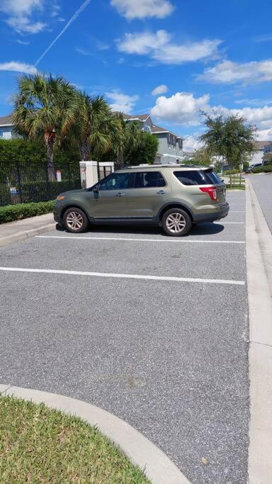 a car parked in a parking lot on a street at 371 P Luxury Villa- New Listing in Orlando