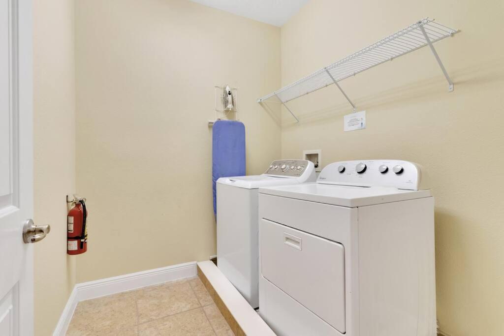 a laundry room with a washer and dryer at 371 P Luxury Villa- New Listing in Orlando
