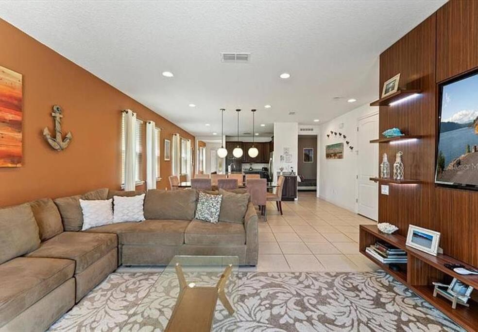 a large living room with a couch and a tv at 371 P Luxury Villa- New Listing in Orlando
