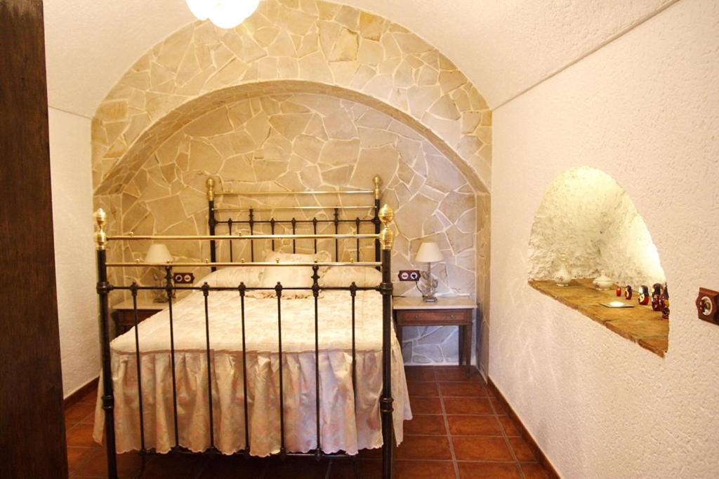 Postel nebo postele na pokoji v ubytování Cuevas las Chimeneas