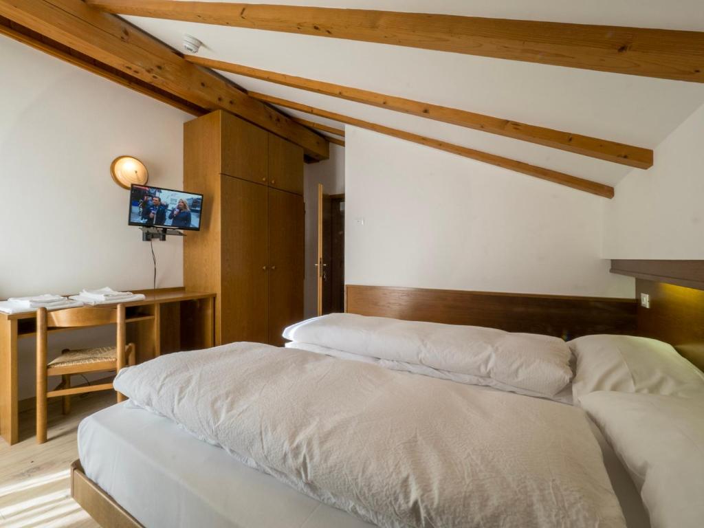 Postel nebo postele na pokoji v ubytování Hotel Ferrari