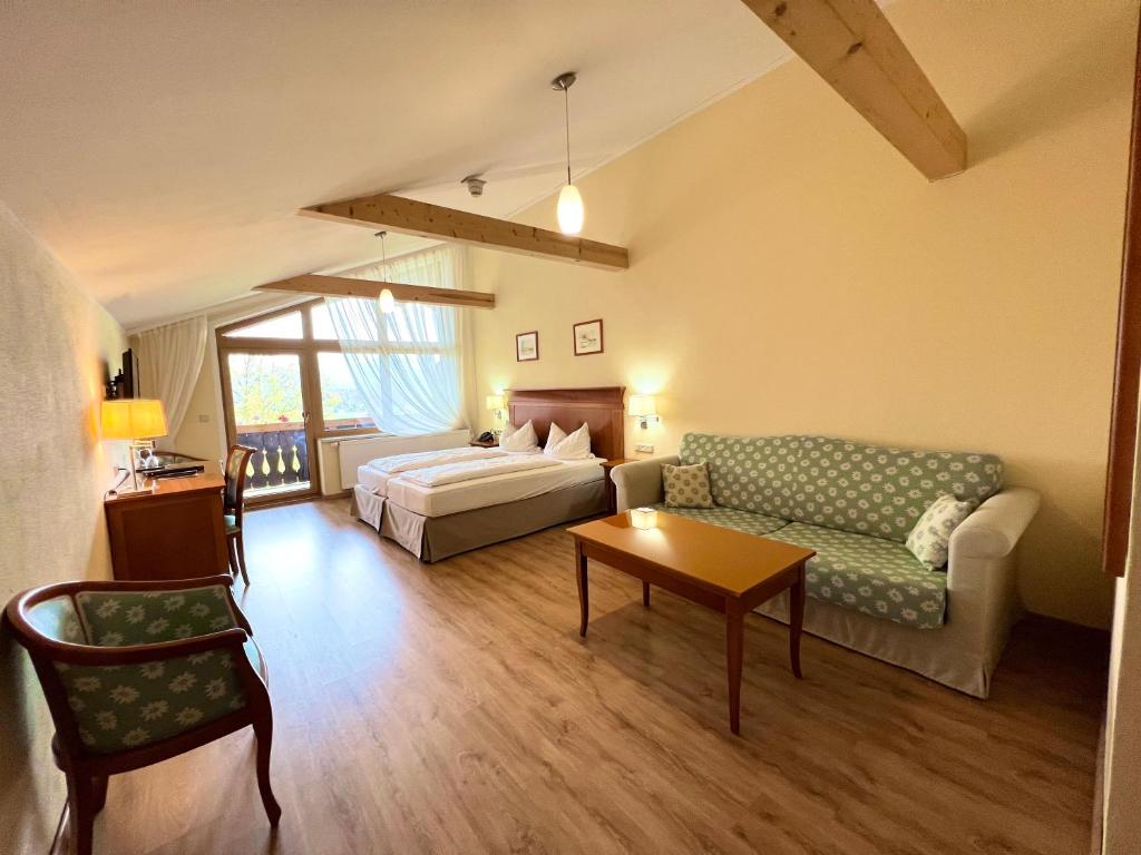 Postel nebo postele na pokoji v ubytování Hotel Bärenstüberl