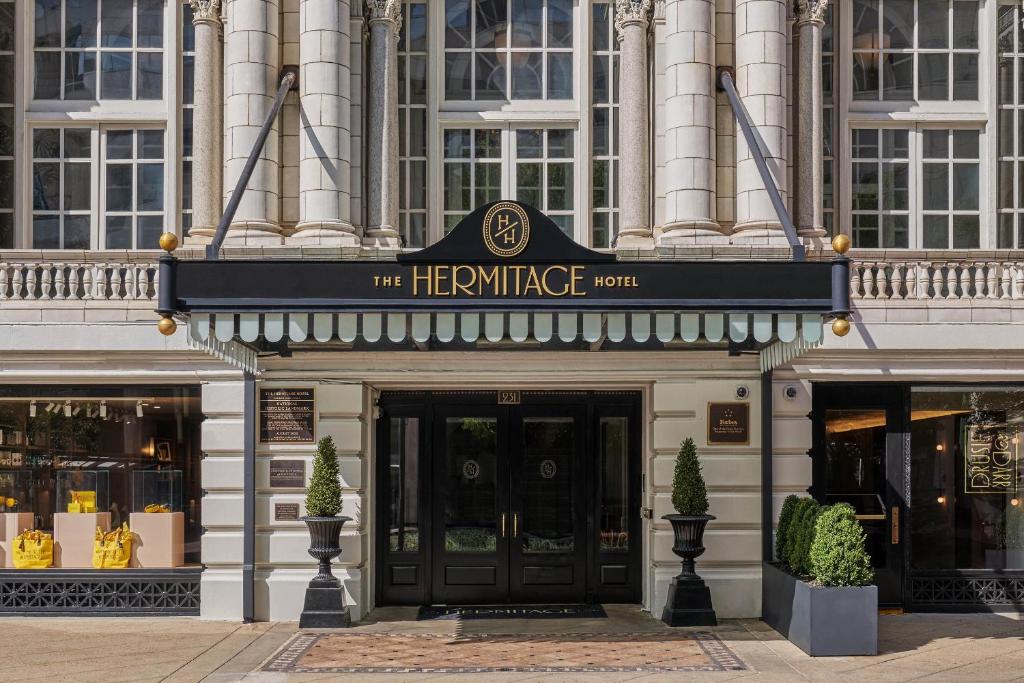 a building with a sign on the front of it at The Hermitage Hotel in Nashville