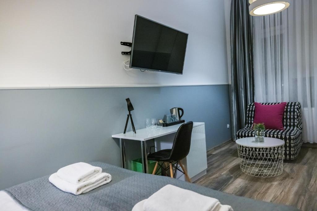 Televízia a/alebo spoločenská miestnosť v ubytovaní Leo Apartments Main Square