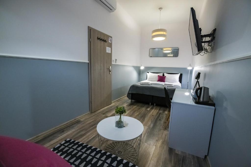 Posteľ alebo postele v izbe v ubytovaní Leo Apartments Main Square