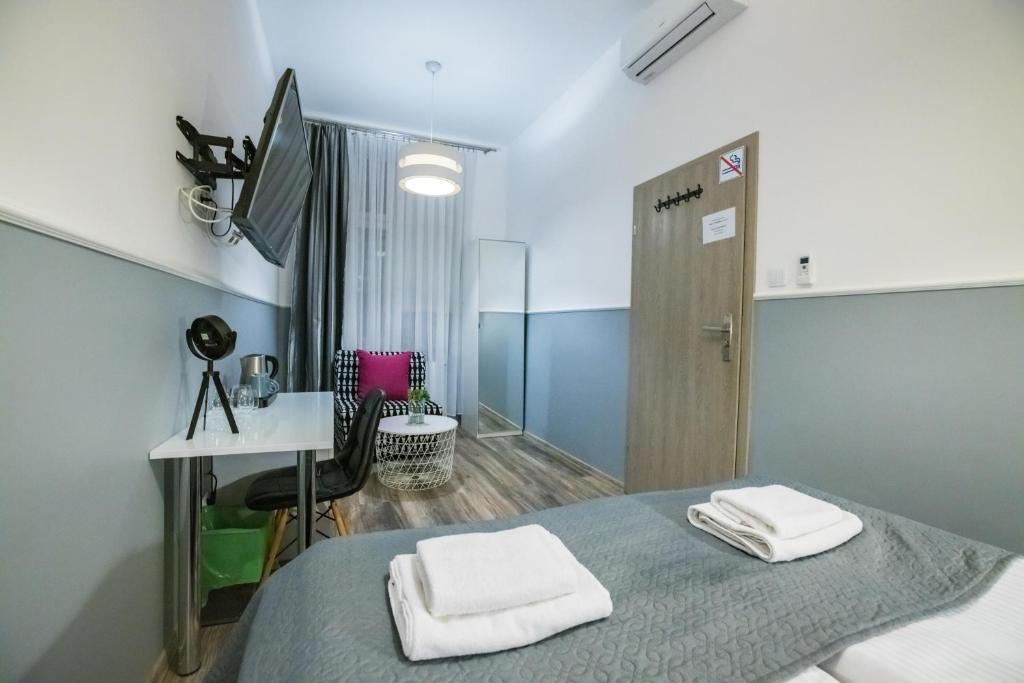 Posteľ alebo postele v izbe v ubytovaní Leo Apartments Main Square