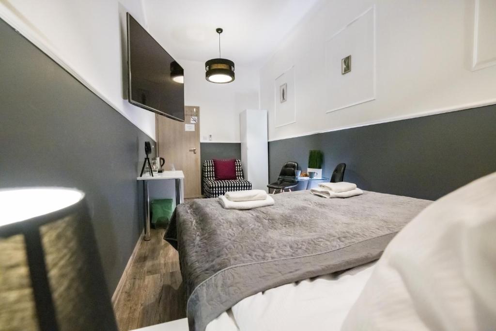 Posteľ alebo postele v izbe v ubytovaní Leo Apartments Main Square