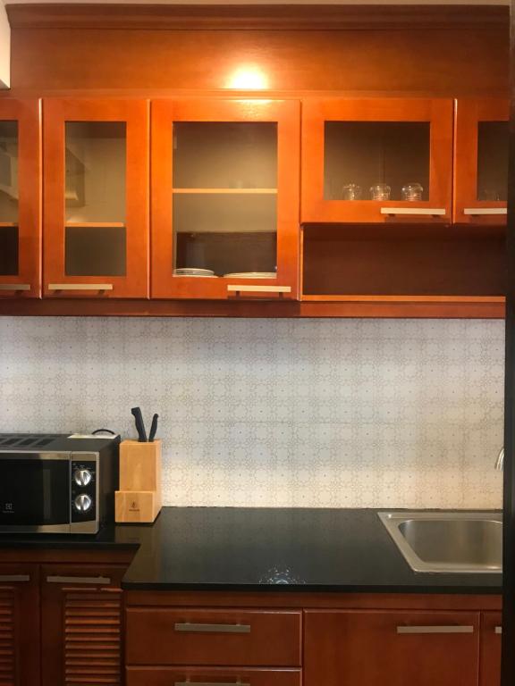 Kuchyň nebo kuchyňský kout v ubytování Jomtien Beach Condominium Rimhad A