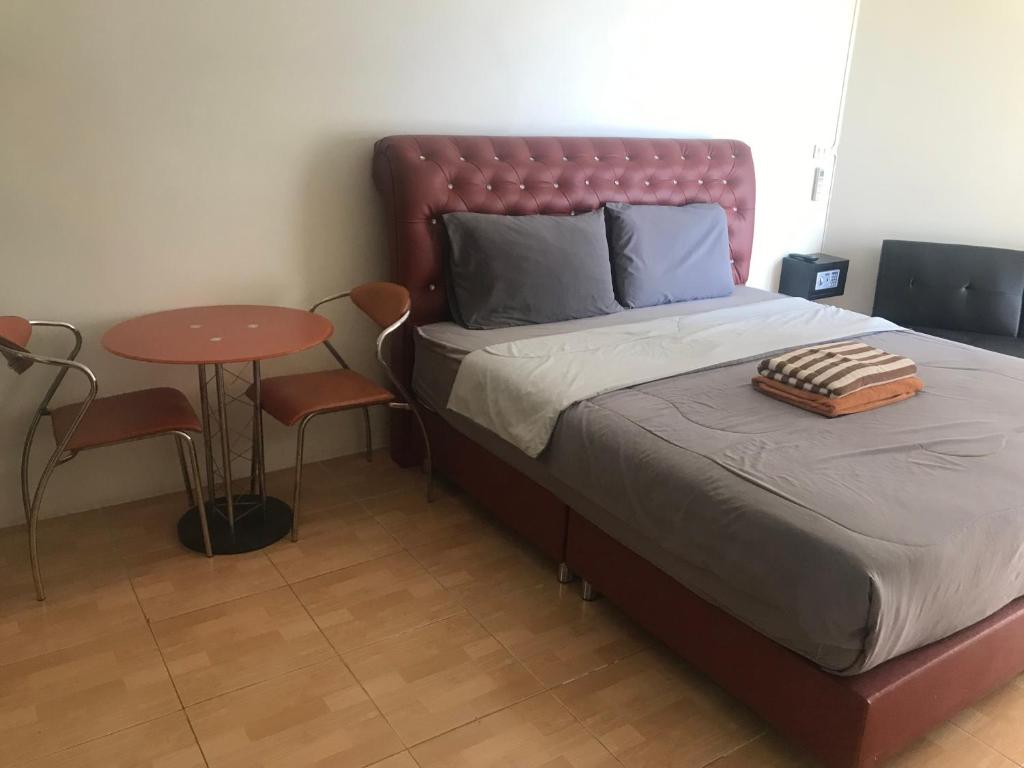 Postel nebo postele na pokoji v ubytování Jomtien Beach Condominium Rimhad A