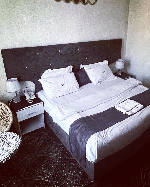 Postel nebo postele na pokoji v ubytování Nur Complex Hotel & Apartment