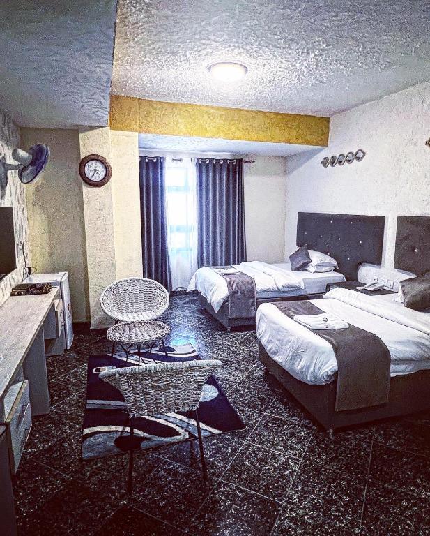 Postel nebo postele na pokoji v ubytování Nur Complex Hotel & Apartment